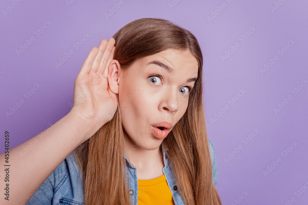 Close up photo of excited gossip girl palm ear listen information on violet background Close up photo of excited gossip girl palm ear listen information on violet background