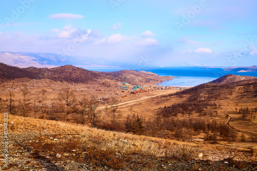 Nature landscape with golden hills with a blue sky with white clouds in a day or a evening