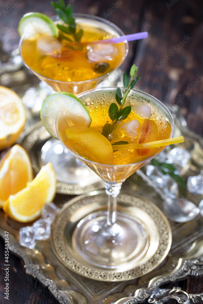 Fruit cocktail, in a glass with natural healthy fruits on a table with kitchen accessories. Fruit cocktail, in a glass with natural healthy fruits on a table with kitchen accessories.