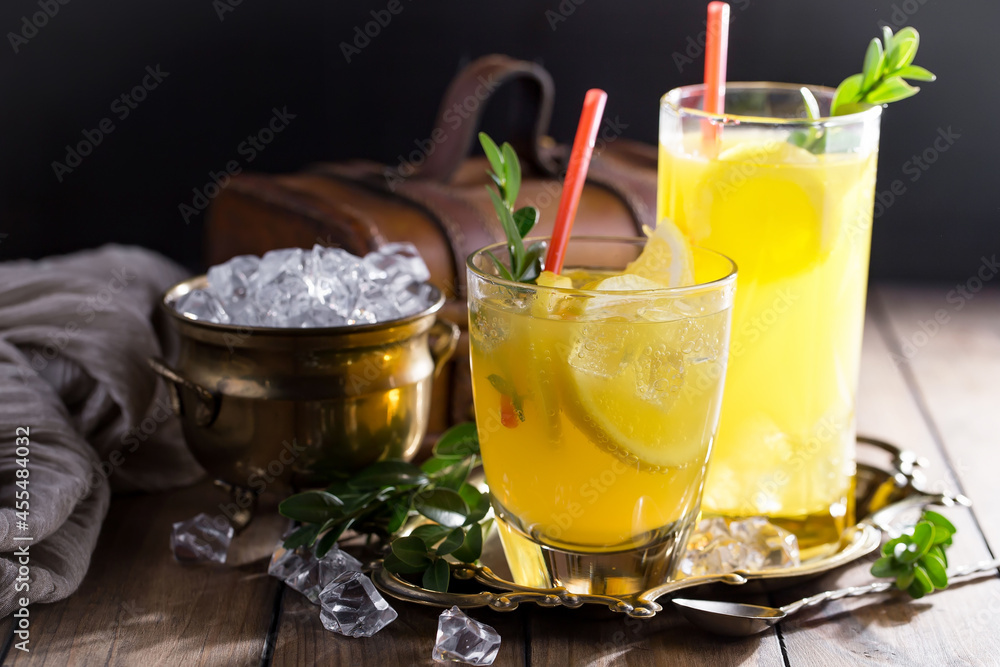Fototapeta premium Fruit cocktail, in a glass with natural healthy fruits on a table with kitchen accessories.