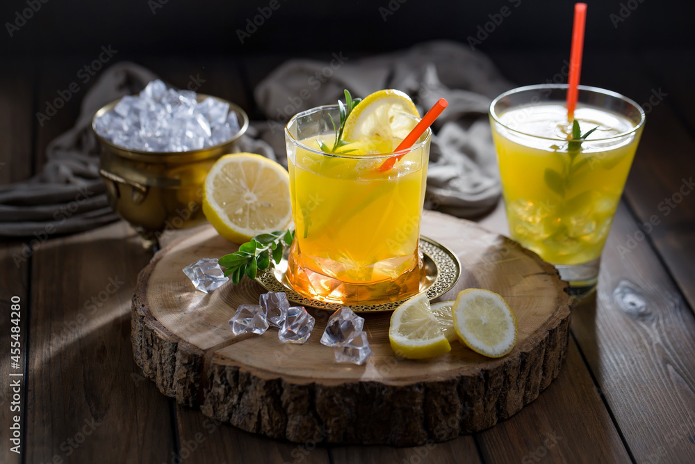 Fototapeta premium Fruit cocktail, in a glass with natural healthy fruits on a table with kitchen accessories.