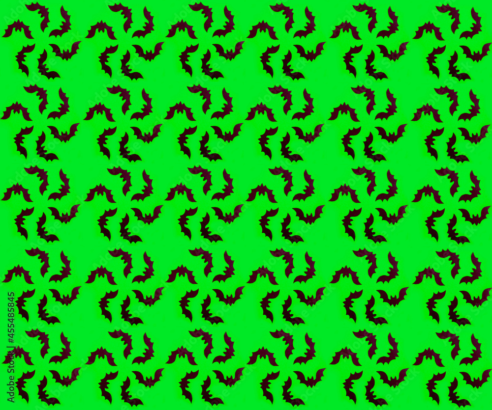 The silhouette of bats is assembled into a round flower. Seamless autumn pattern on a green background for Halloween. Gift wrapping paper for Halloween. Halloween textiles. The silhouette of bats is assembled into a round flower. Seamless autumn pattern on a green background for Halloween. Gift wrapping paper for Halloween. Halloween textiles.