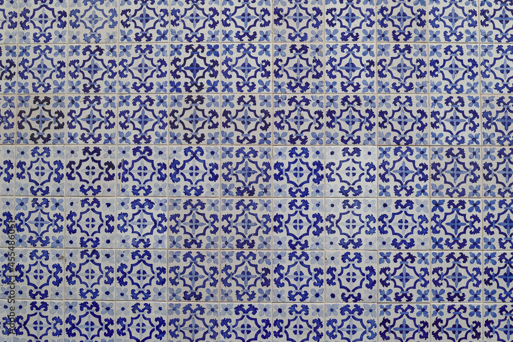 Blue and white traditional spanish tiles wall background