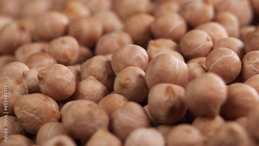 Raw chickpeas, rotation. Chickpeas, close-up dolly shot. Macro footage of chickpeas beans. Food cooking video. Raw chickpeas, rotation. Chickpeas, close-up dolly shot. Macro footage of chickpeas beans. Food cooking video.