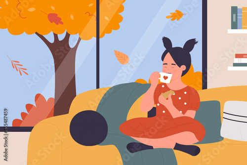 Happy girl drinking hot drink, eating cookies at home vector illustration. Cartoon kid character holding tea cup and sweet snack dessert, sitting on sofa by window with autumn landscape background