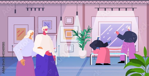 senior people visiting art gallery aged men women visitors viewing exhibits in museum old age concept