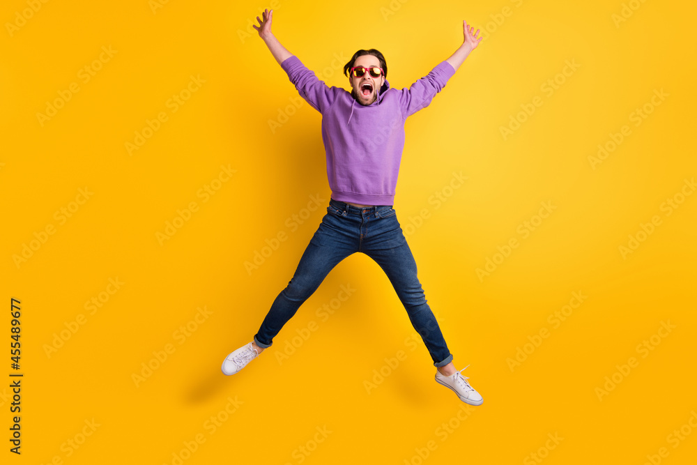 Full body photo of young excited man happy positive smile jumper cool active isolated over yellow color background
