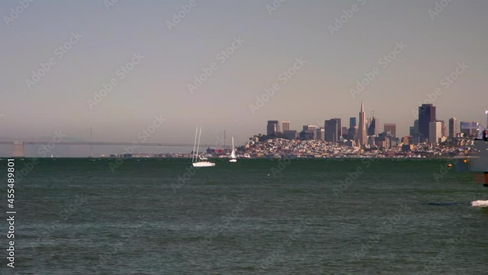 Time Lapse Lockdown Shot Of Boats Moving In Sea By City Against Clear Sky - Vancouver, Canada Time Lapse Lockdown Shot Of Boats Moving In Sea By City Against Clear Sky - Vancouver, Canada