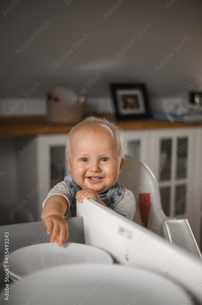 close up portrait of cute boy smiling eating baby food. Happy childhood close up portrait of cute boy smiling eating baby food. Happy childhood