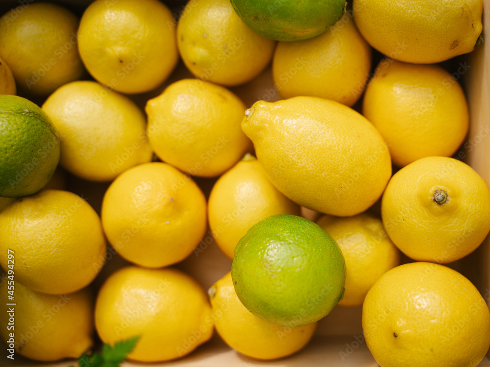 Juicy lemons on the counter in the supermarket. Close-up. Healthy eating and vegetarianism. Space for text. Background. Juicy lemons on the counter in the supermarket. Close-up. Healthy eating and vegetarianism. Space for text. Background.