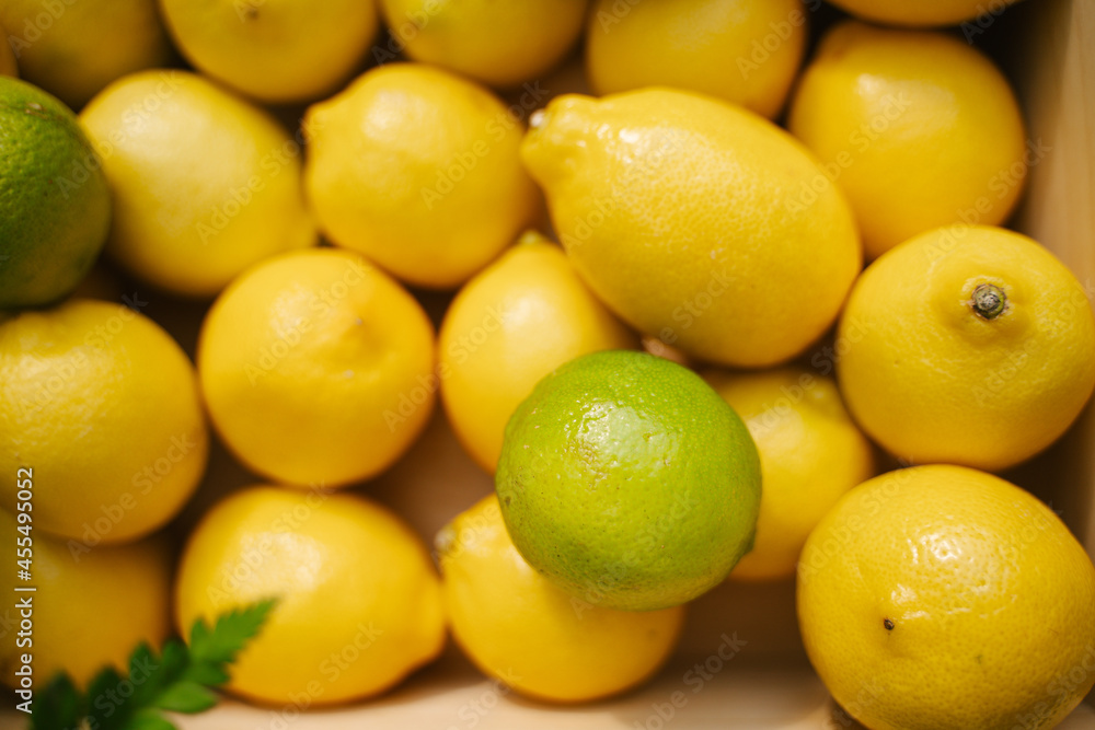Juicy lemons on the counter in the supermarket. Close-up. Healthy eating and vegetarianism. Space for text. Background. Juicy lemons on the counter in the supermarket. Close-up. Healthy eating and vegetarianism. Space for text. Background.