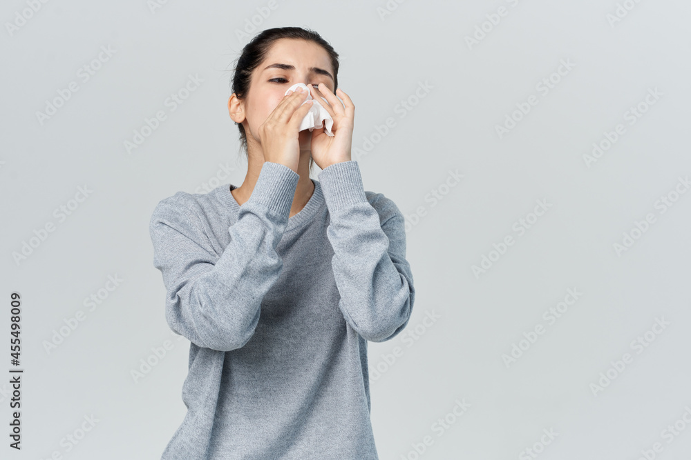 woman wipes her nose with a handkerchief infection allergy runny nose woman wipes her nose with a handkerchief infection allergy runny nose