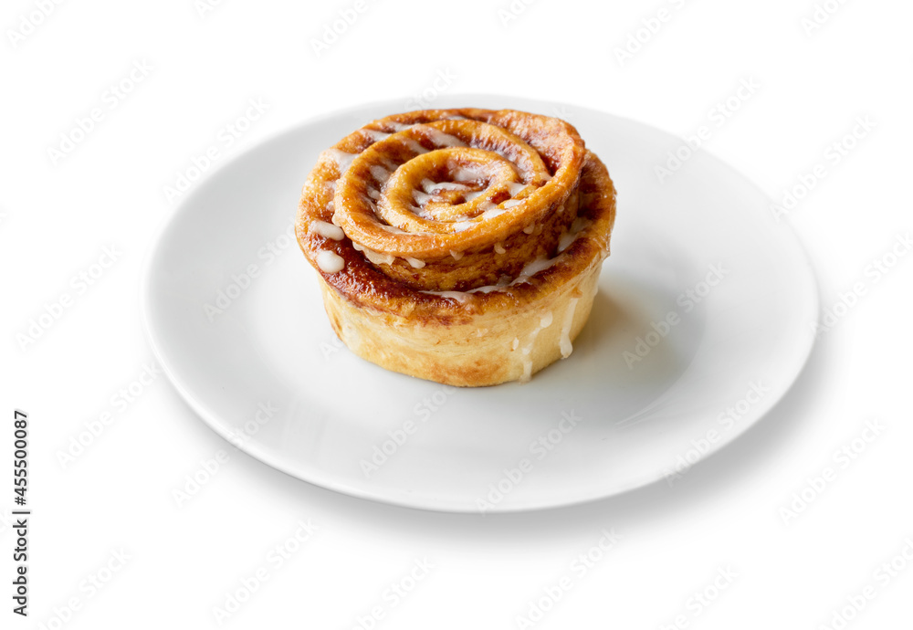 Cinnamon roll put on a plate on white background. File contains with clipping path so easy to work. Cinnamon roll put on a plate on white background. File contains with clipping path so easy to work.