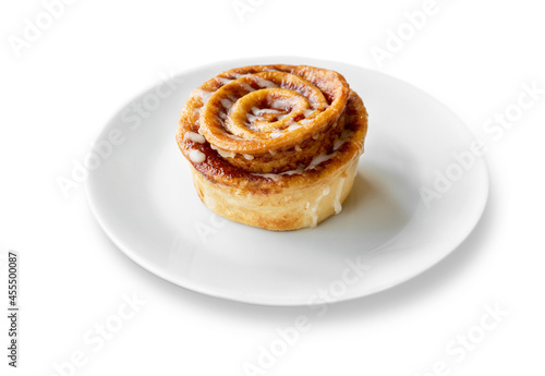 Cinnamon roll put on a plate on white background. File contains with clipping path so easy to work.