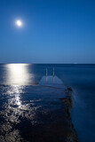 The moon rising over the beach at Losinj island, Croatia. 
