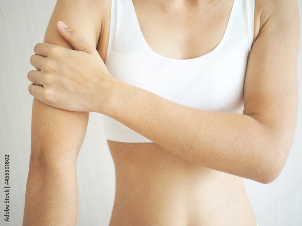 Woman with arm pain from muscle inflammation. health concept.