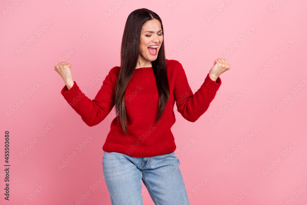 Photo of funny brunette lady hands fists yell wear red pullover isolated on pink color background Photo of funny brunette lady hands fists yell wear red pullover isolated on pink color background