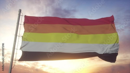 Lithsexual pride flag waving in the wind, sky and sun background photo