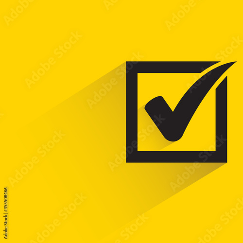 check mark with shadow on yellow background