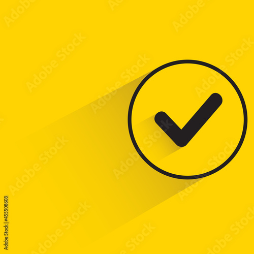 check mark with shadow on yellow background