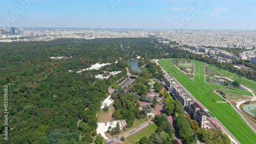 Paris: Aerial view of capital city of France, famous public park Bois de Boulogne and Hippodrome d'Auteuil, sunny with blue sky  - landscape panorama of Europe from above photo