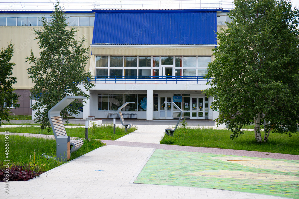 Original benches  in the Geologists ' Square in the city of Noyabrsk in summer