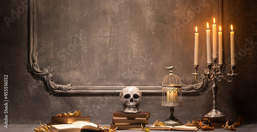 Konstfotografi Scary laughing pumpkin and old skull on ancient gothic fireplace