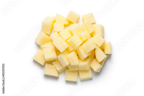Pile of chopped raw potatoes isolated on white background. Top view.