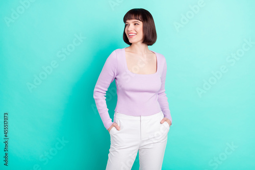 Photo portrait woman wearing casual clothes smiling dreamy looking empty space isolated bright teal color background