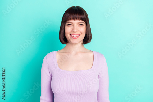 Photo portrait woman with bob hair smiling in casual outfit isolated bright teal color background