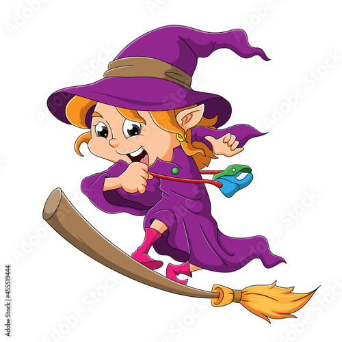 The happy witch is standing in the magic broom