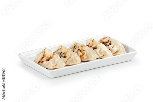 Plate of gyoza on white background. Asian food