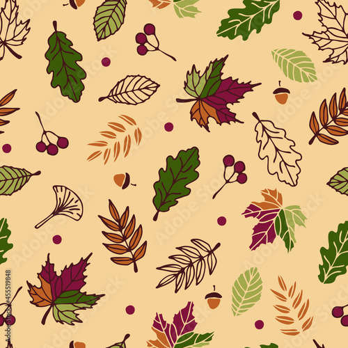 Seamless vector pattern with autumn leaves on yellow background. Seasonal forest wallpaper design. Decorative fall fashion textile.