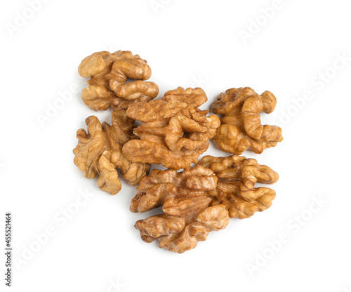 Pile of peeled walnuts on white background, top view