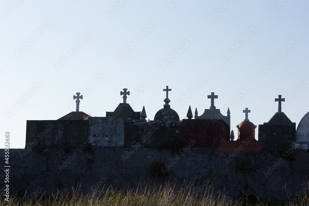 Silhouettes of crosses in a cemetery in Galicia, Spain.