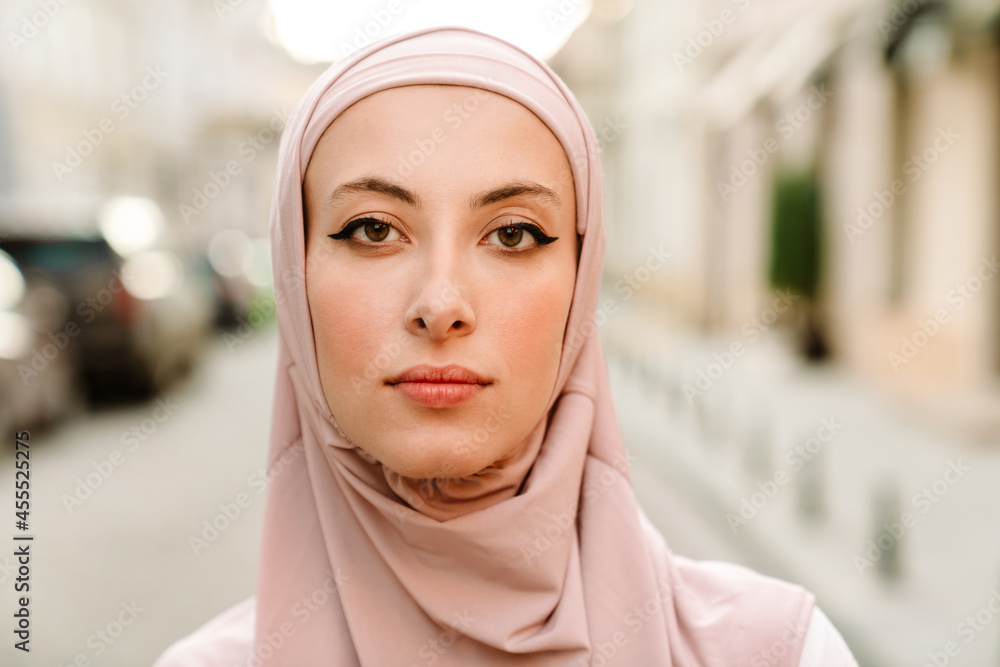 Close up of a smiling young muslim woman in hijab