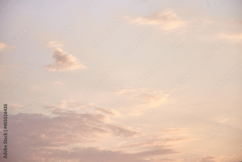 Delicate pink evening sky background. Natural texture in golden sunset hour