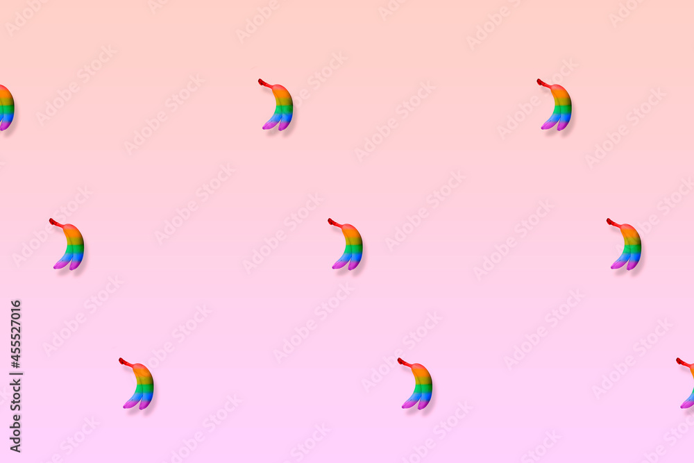 Rainbow colored bananas on a minimalistic background