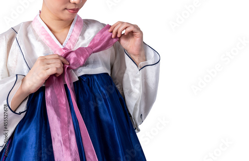 Asian woman wearing a traditional Hanbok, which is a Korean national costume, On white isolated background, to people and culture concept.