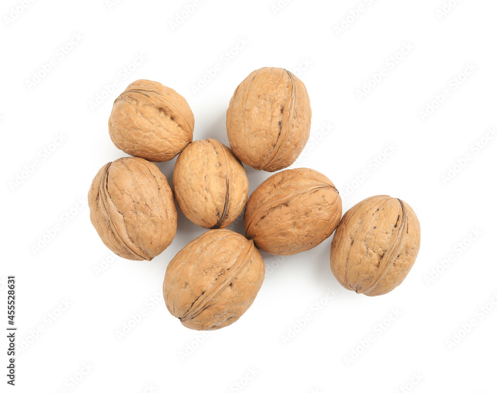 Whole walnuts in shell on white background, top view Whole walnuts in shell on white background, top view