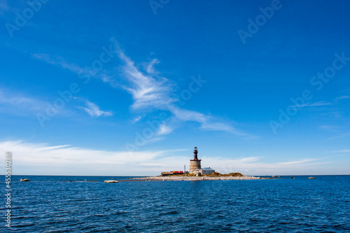 Buildings and the lighthouse on small remote Keri island seen from distance at the Baltic Sea in Estonia, Europe