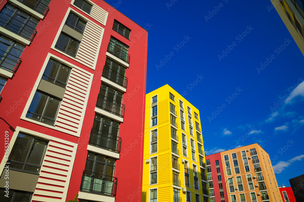 vibrant colorful apartment estate exterior facade foreshortening from below