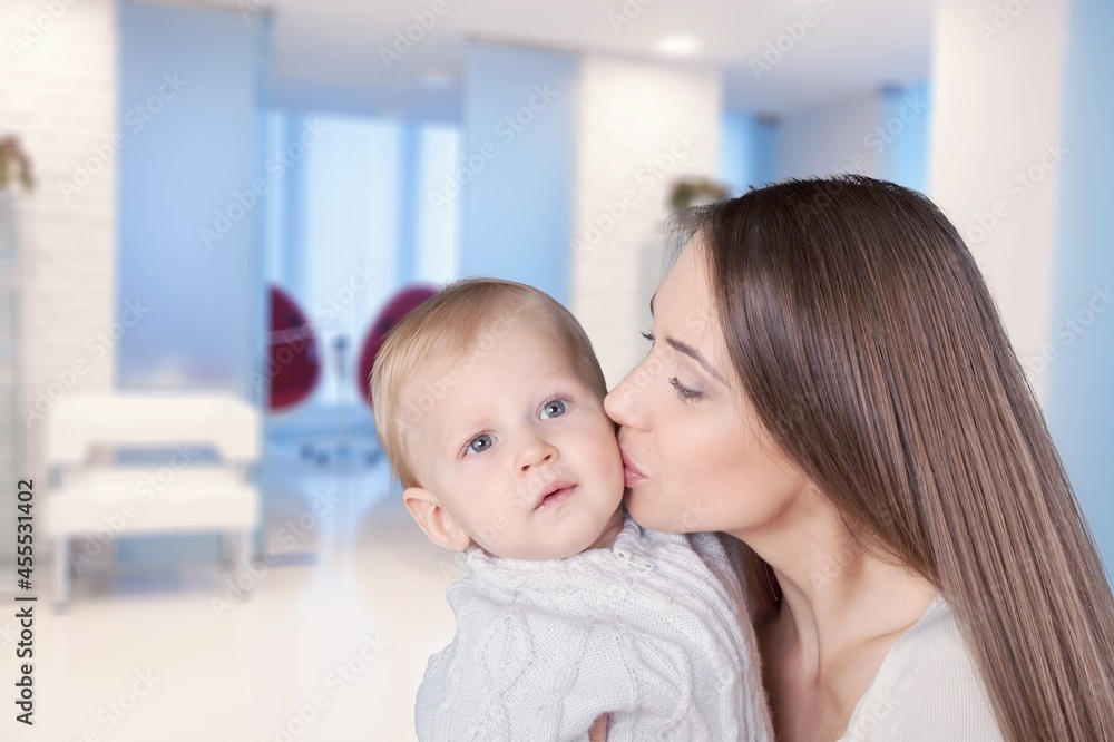 Young beautiful mother lifting and playing with her baby. Young beautiful mother lifting and playing with her baby.