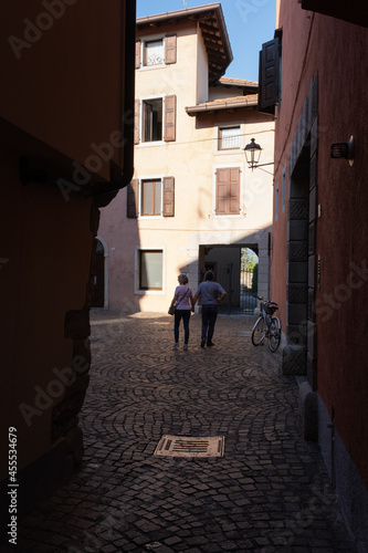 Cividale del Friuli (Udine), Italy - September 5, 2021: North Italy Life in the center of the lombard medieval city. Walking through narrow streets and walls. Sunny summer day. Selective focus © Maurizio