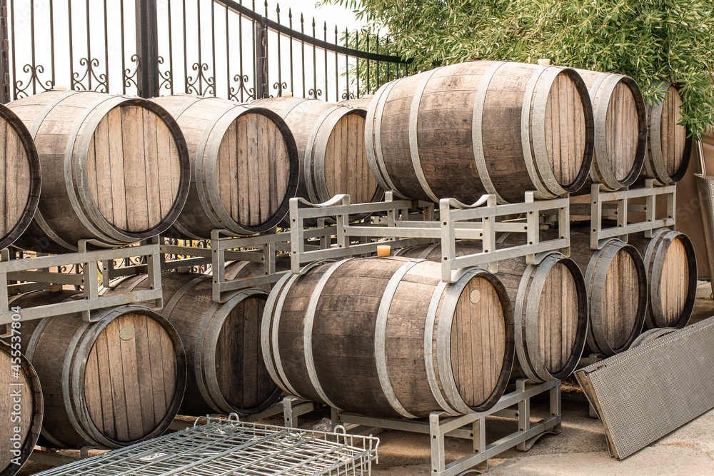 Wooden barrels for wine in the courtyard of the winery