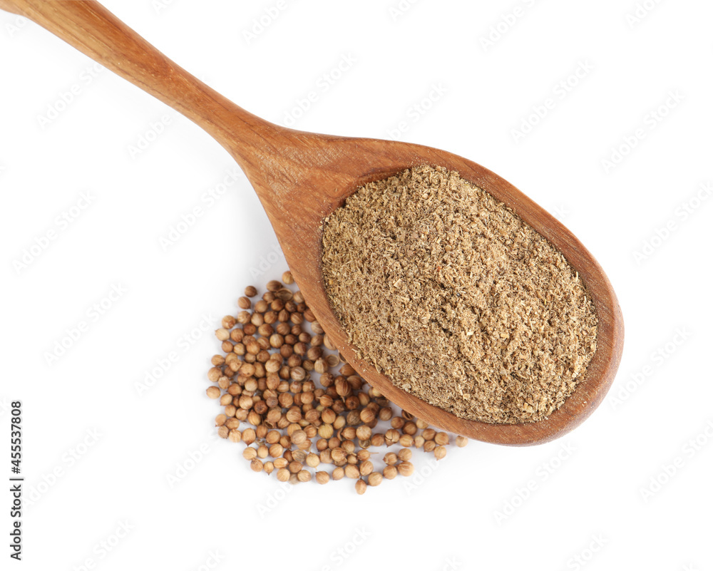 Wooden spoon with powdered coriander and corns on white background, top view Wooden spoon with powdered coriander and corns on white background, top view