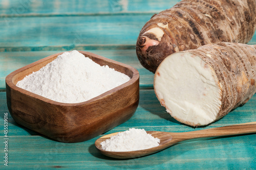 Taro Root of Colocasia esculenta and Organic Taro Flour in a bowl