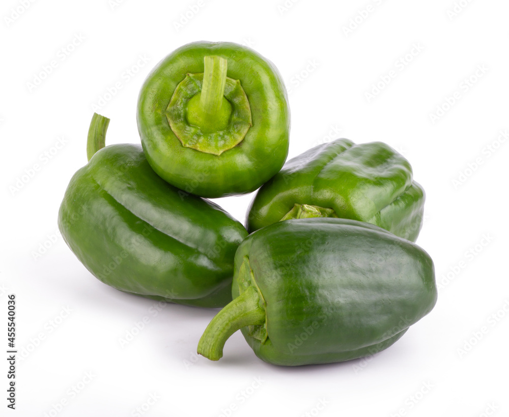 Group of fresh green bell peppers with slices isolated on a white background close up Group of fresh green bell peppers with slices isolated on a white background close up