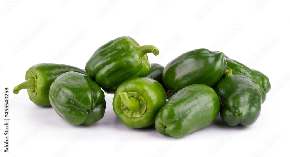 Group of fresh green bell peppers isolated on a white background close up Group of fresh green bell peppers isolated on a white background close up