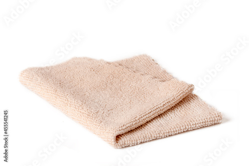 Beige microfiber cloth for cleaning premises. Housework and office work.